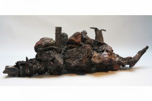 MINE MEMORY BACKBONE. mine spoil rocks, cast iron, ceramic 96cm long x 26cm high x 20cm deep